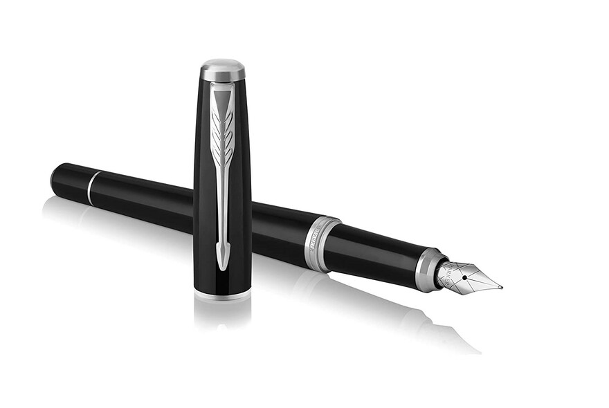 A black fountain pen with lid standing upright.