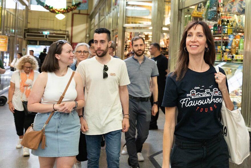 Shoppers at the Queen Victoria Market, walking through the entrance.