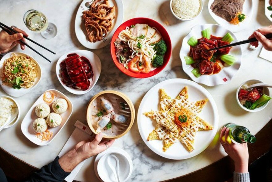 A selection of Asian food on a marble table 