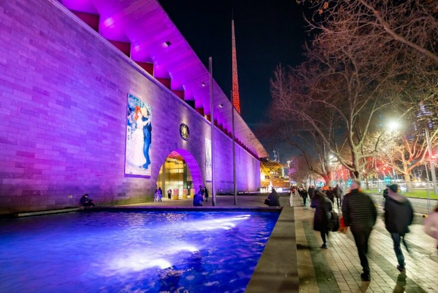 The National Gallery Victoria lit up at night. 