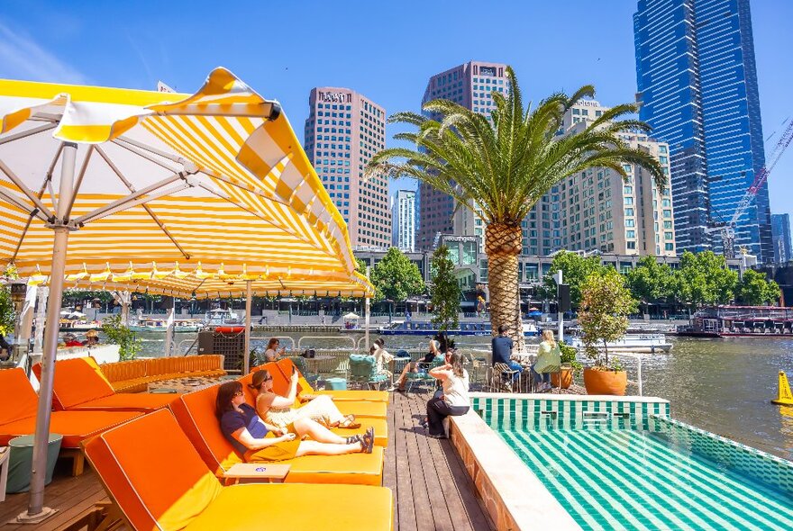 A bar pool club floating on a river.