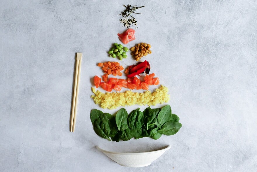 Leaves, beans and rice arranged into shape of a ship.