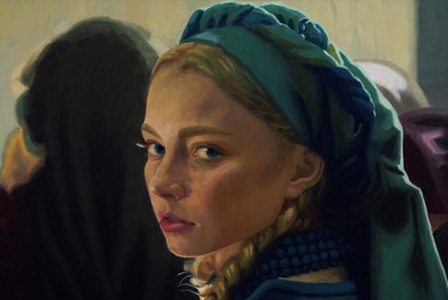 Woman wearing a turban and earring, emulating the Vermeer painting.