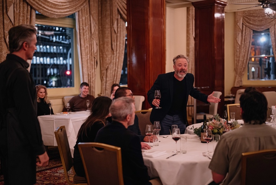 Actors performing in a play that takes place in a hotel dining room. 