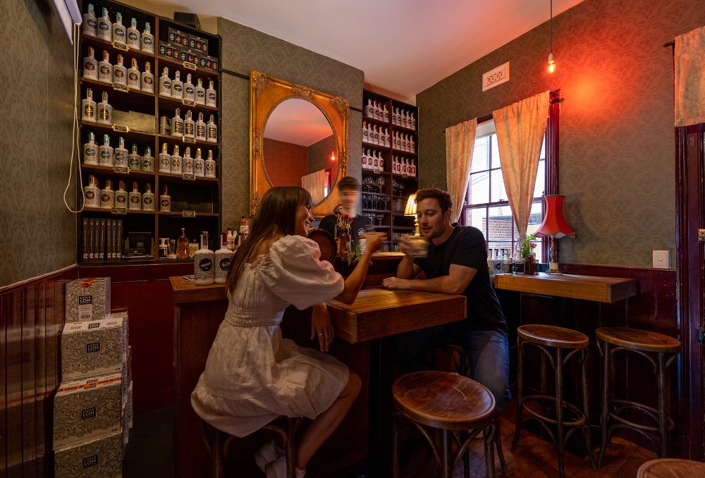 A couple sitting in a cosy bar.