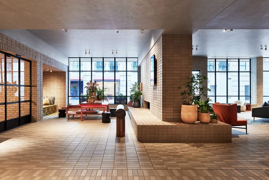 An empty hotel lobby space in brown tones. 