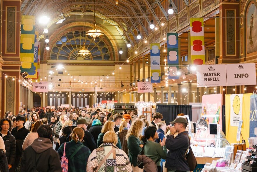 People at an indoor market at the Royal Exhibition Building. 