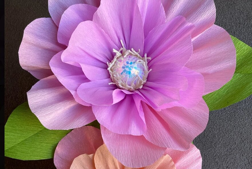 An oversized hand made paper flower.