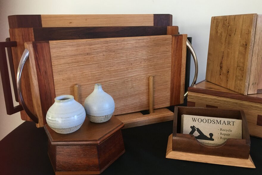 Examples of woodworking and pottery at a market stall.