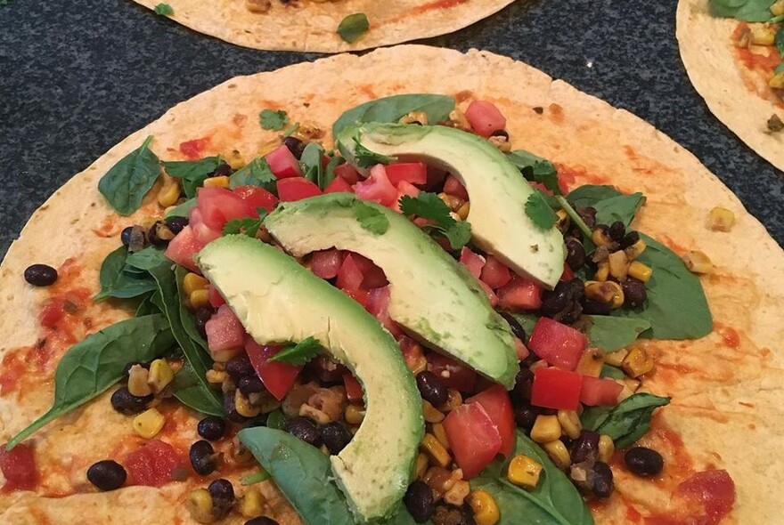 Pitta bread with avocado salad.