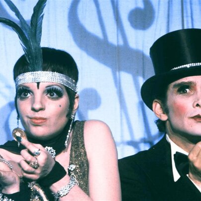 Liza Minelli and Joel Grey performing wearing 1930s vaudeville costume in a still from the movie Cabaret.