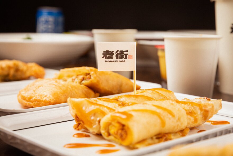 Trays of Asian takeaway foods.