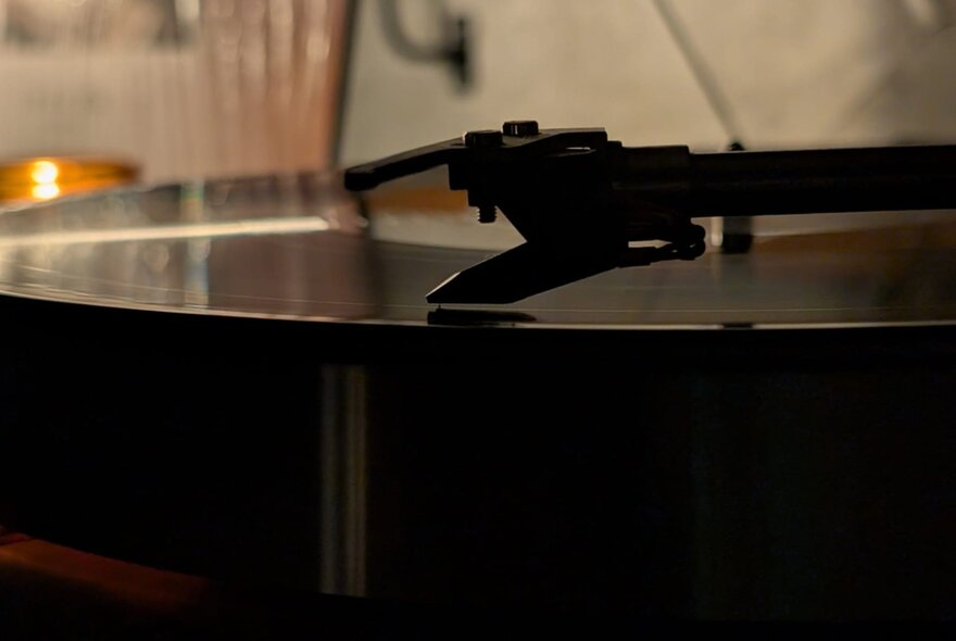 Close up of a turntable with the record playing. 