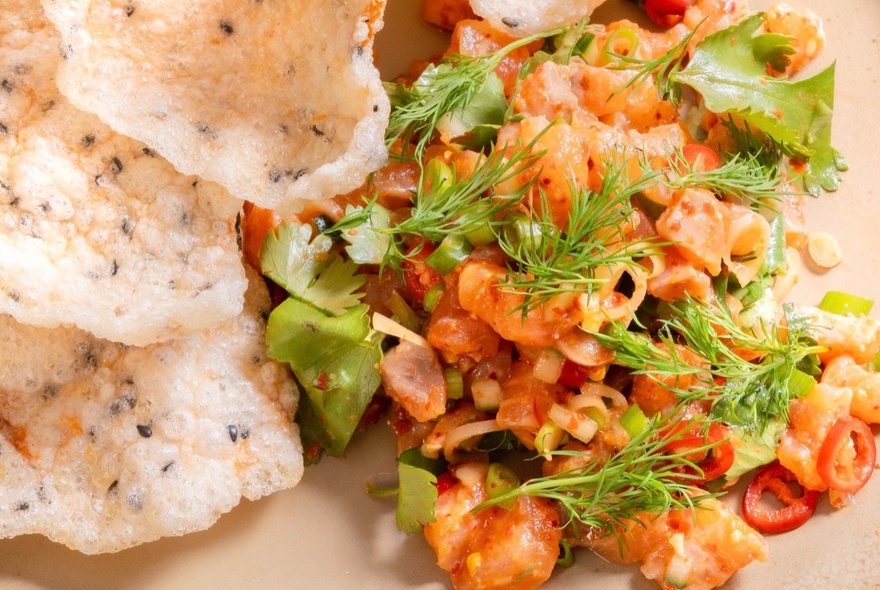 Minced chicken with crispy puff and Asian style garnishes.