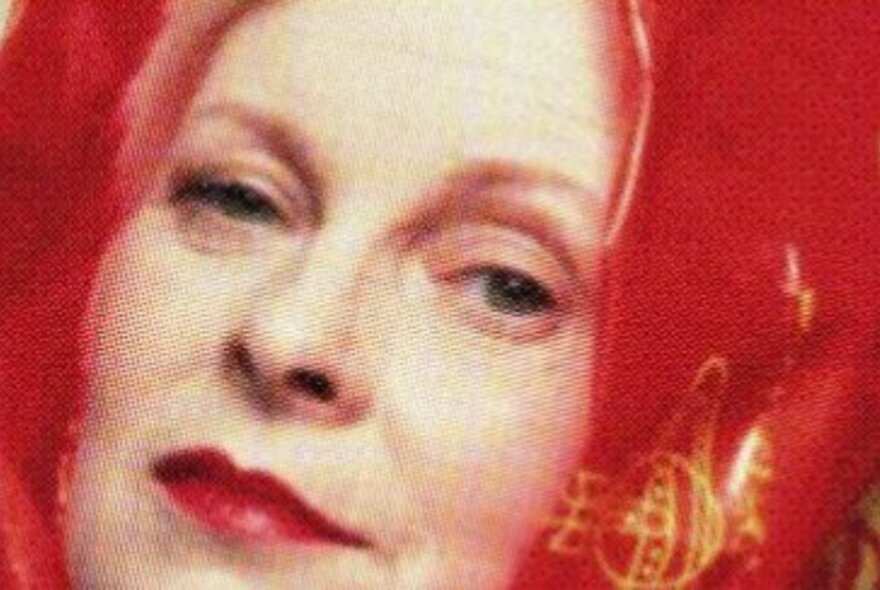 Vivienne Westwood with red scarf and lipstick.
