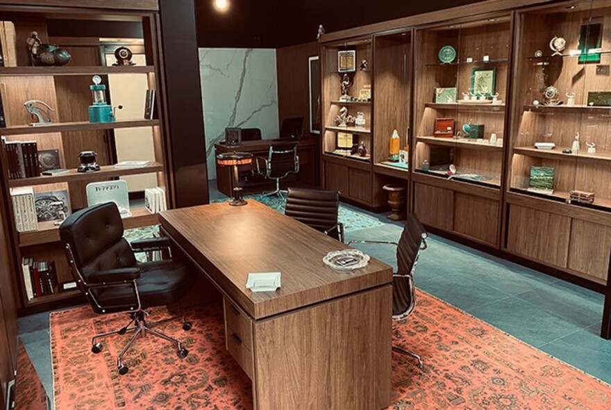 Watchtime interior with wooden desk and subtly lit shelves displaying items.