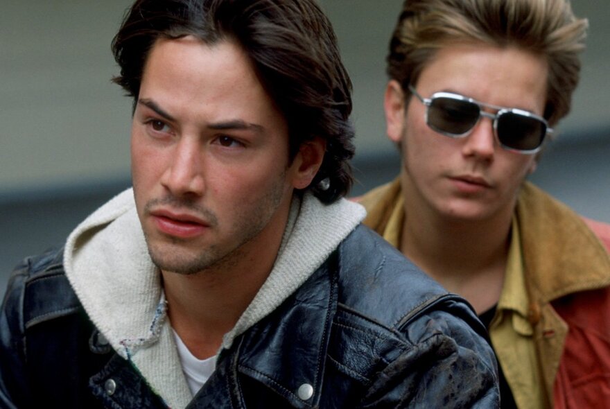 Still of young actors Keanu Reeves (left) and River Phoenix (right) from the 1991 cult classic film My Own Private Idaho.
