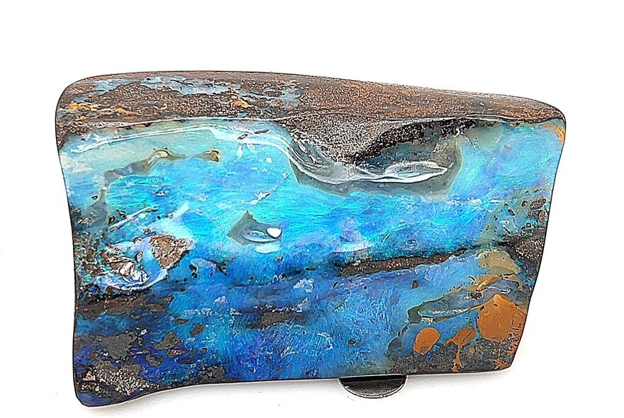 A large blue opal in a wedge shape. 