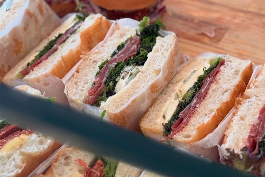 Rows of filled foccacia sandwiches.