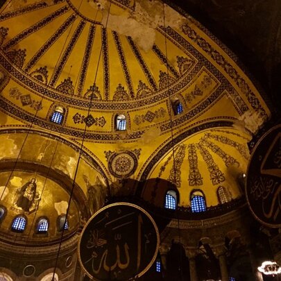 The inside of an elaborate domed theatre.