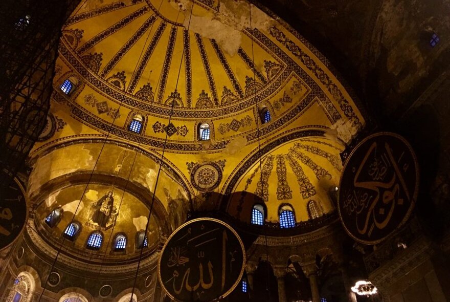 The inside of an elaborate domed theatre.