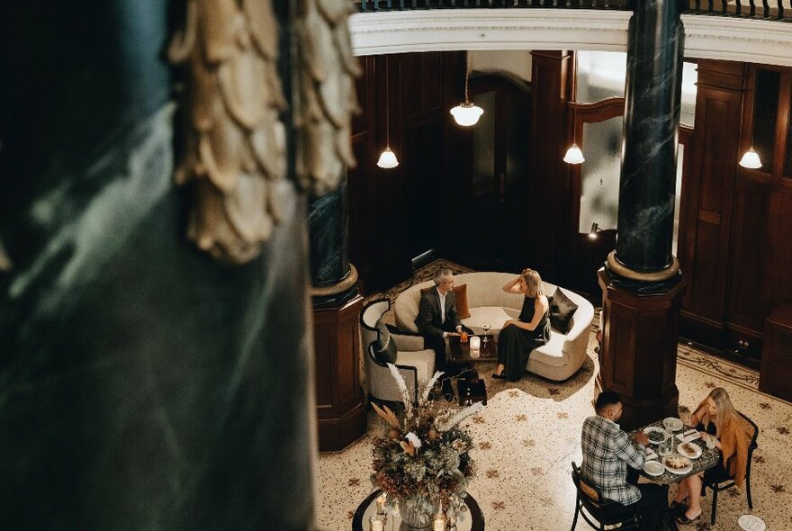 A high view over a cosy lounge at the Rendezvous Hotel Melbourne.