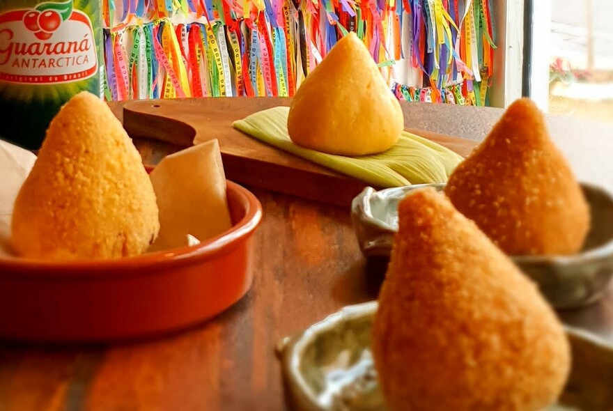 Golden cones of food in small bowls.