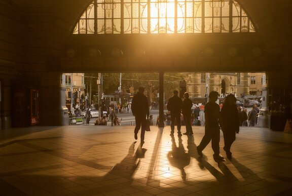 The sun setting through the main entrance of Flinders Street Station.