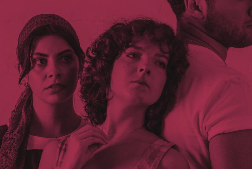Two woman, one leaning back into the back of a man, with a deep fuschia wash over the image.