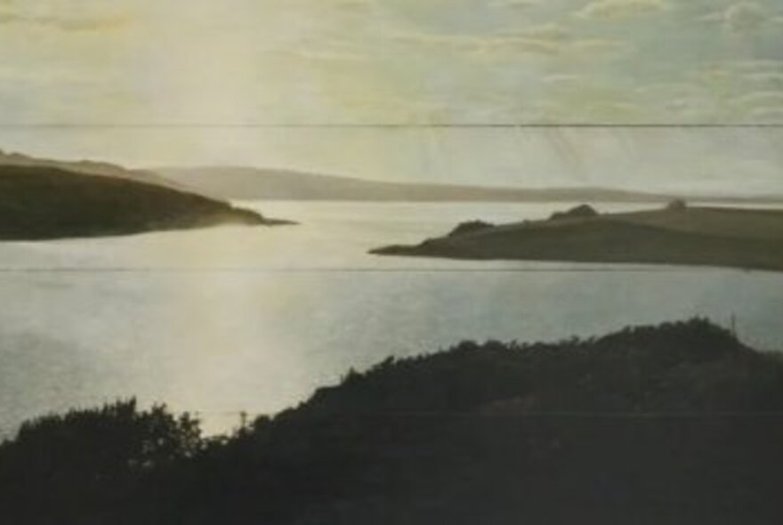 An example of Michael Bragge's 6x4 inch landscape paintings, showing a wide estuary and the sea beyond.