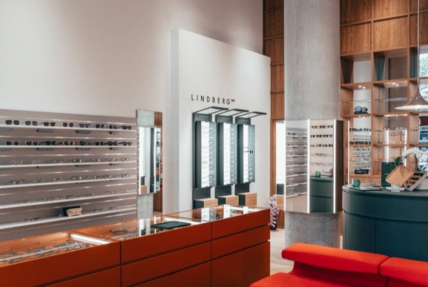 Interior of Seasons Optical, with eyewear on display in cabinets and on the wall.