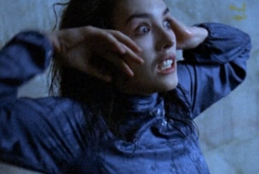 Actress Isabelle Adjani with her hands held up to her face in a scene from the horror film Possession.