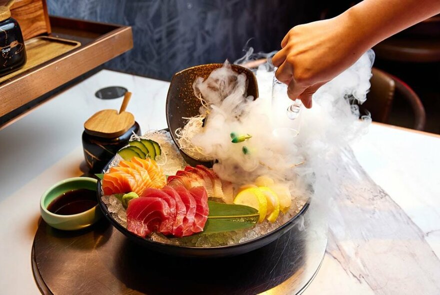 Raw slices of meat and vegetables in a hot pot.