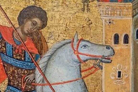 Crusader on a white horse outside a golden tower.