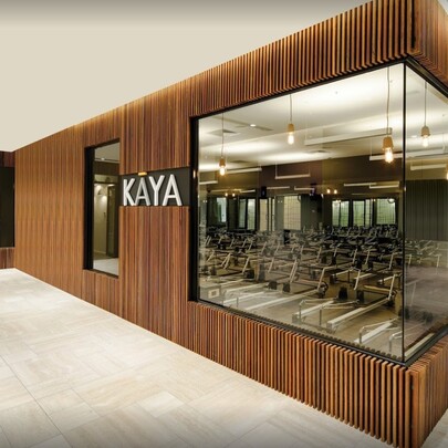 Fitness equipment seen through Kaya health club window.