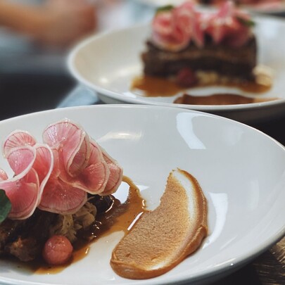 White plates with prosciutto antipasto.