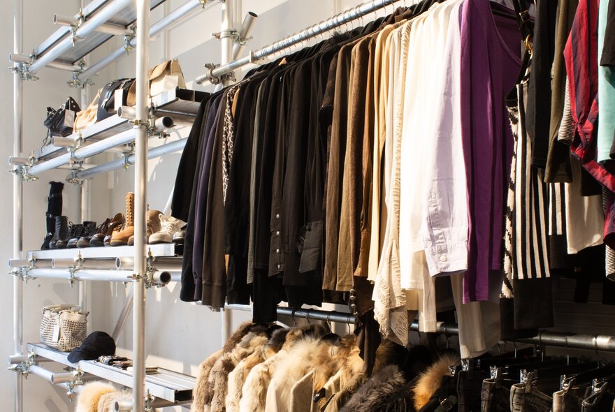 Racks of clothing in a store. 