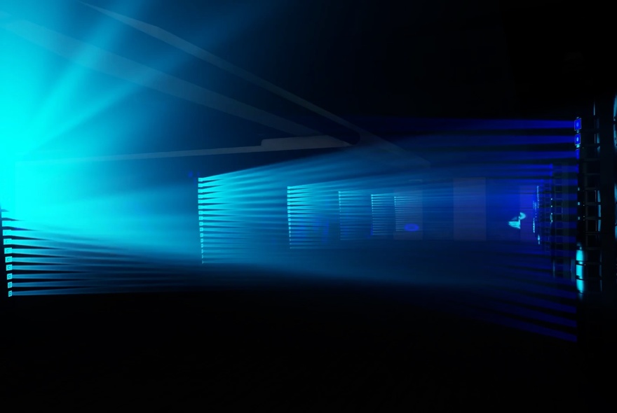 A light show experience showing a cast of aqua light beaming from the left of the picture. 