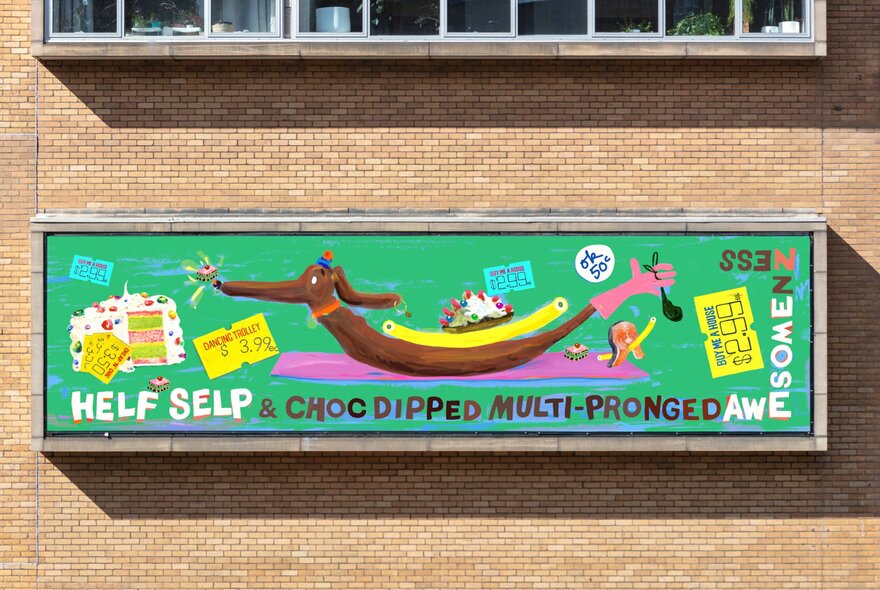 Close-up of the artwork Helf Selp & multi-pronged awesomeness by artist Anna Hoyle, on the cream brick facade of the Hero apartment building.