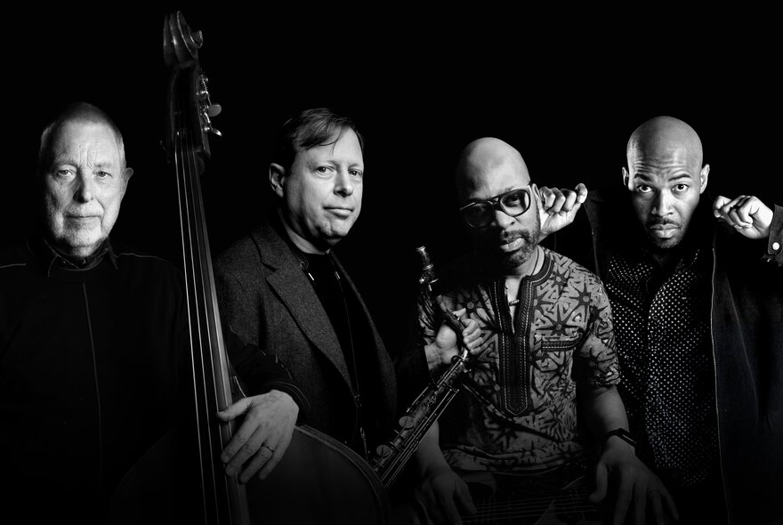 Four jazz musicians with their instruments.