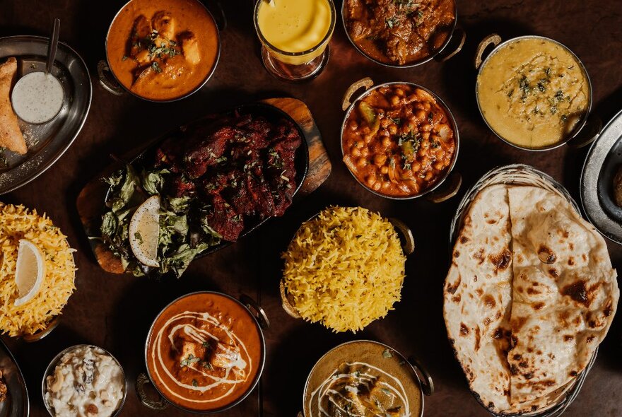 Selection of Indian dishes on a restaurant table.