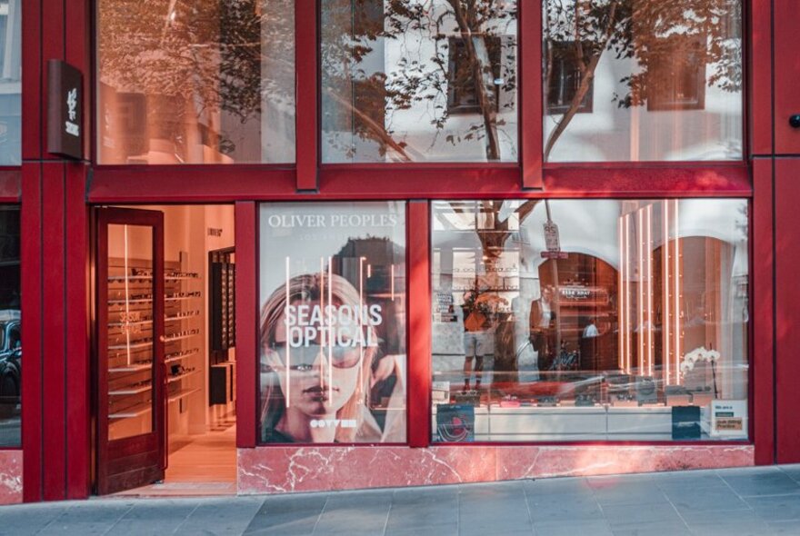 Glass walled exterior of Seasons Optical store in a Melbourne street.