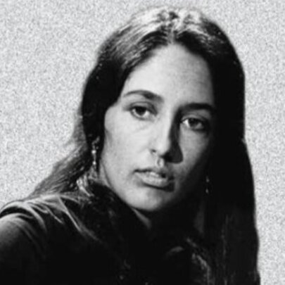 Sixties singer Joan Baez, with long dark hair and earrings.