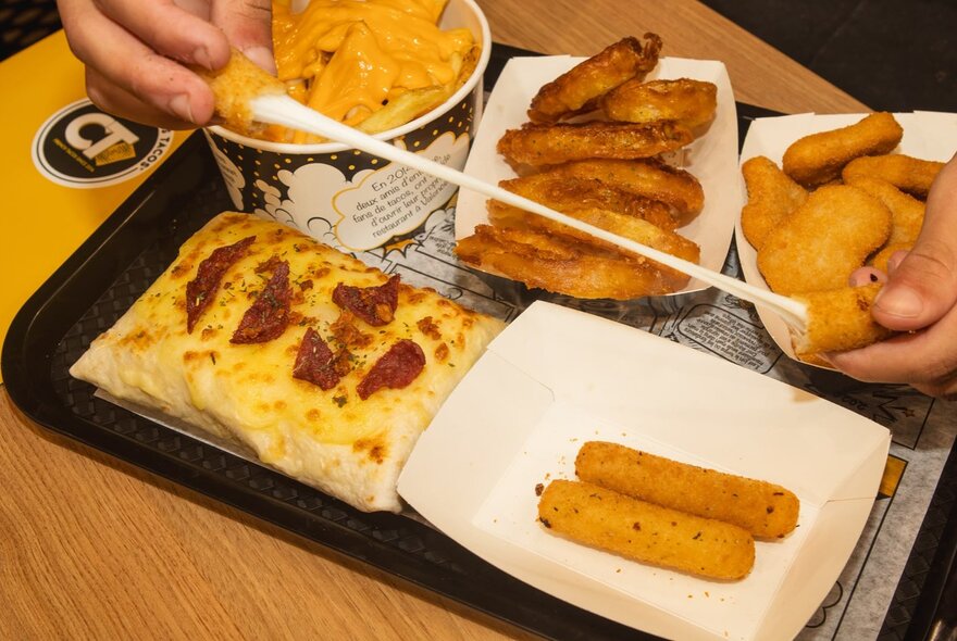 A fast-food sharing platter from Chamas Tacos featuring their cheesy filled tacos, and fries. 