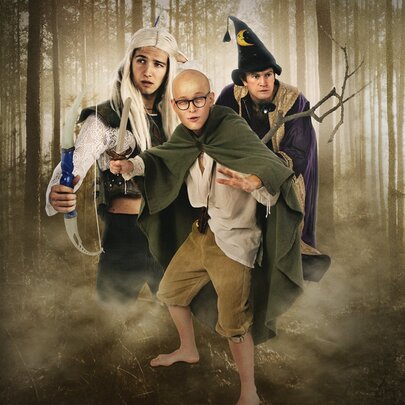 A stylised image of three people dressed as charcters from Lord of the Rings in a forest.