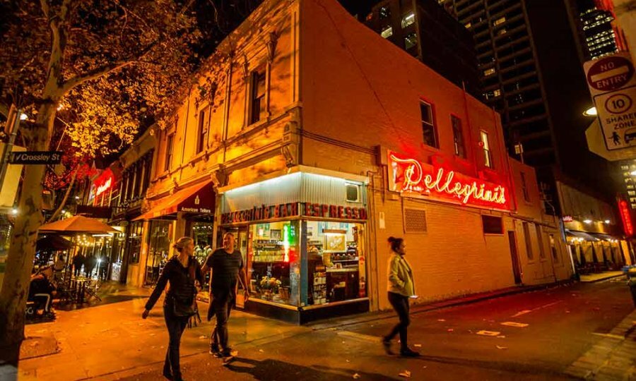 Shopfront of restaurant at night. 