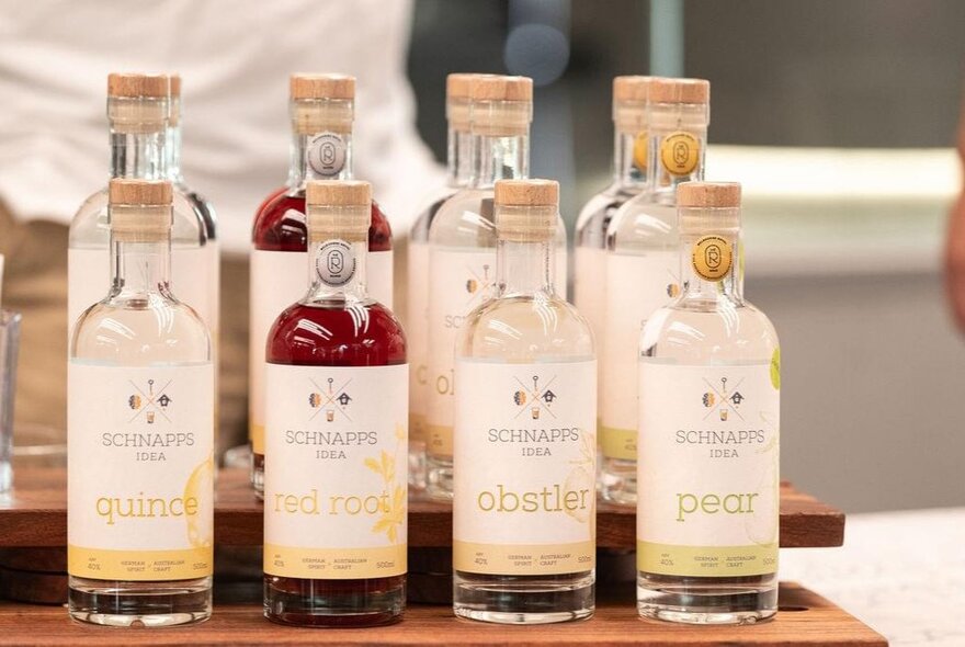 Bottles of flavoured Schnapps displayed on a shelf.