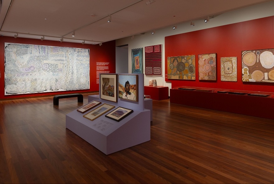 Installation view of an exhibition in a gallery featuring works by Aboriginal and Torres Strait Islander artists.