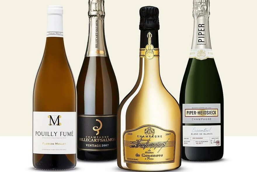 Four bottles of assorted wines.