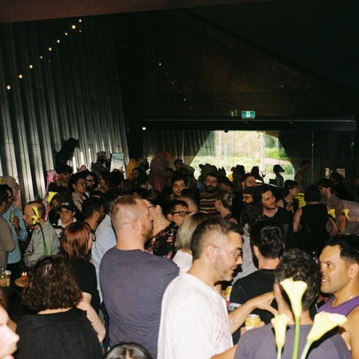 A crowd of people enjoying an after hours party at the Australian Centre for Contemporary Art.